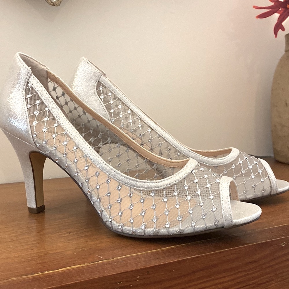 Silver open toe shoes.